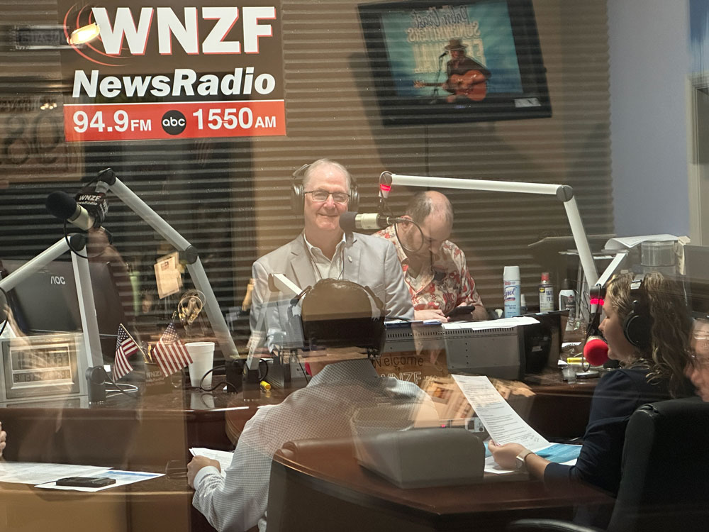 Flagler Broadcasting President David Ayres has been anchoring the annual Food-A-Thon since 2022. This year's edition has special urgency, with the halt to food stamps affecting some 13,000 recipients in Flagler County. (© FlaglerLive)