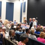 David Jolly, standing in the dark suit, with supporters before his town hall at Palm Coast United Methodist Church on Wednesday. (© FlaglerLive)