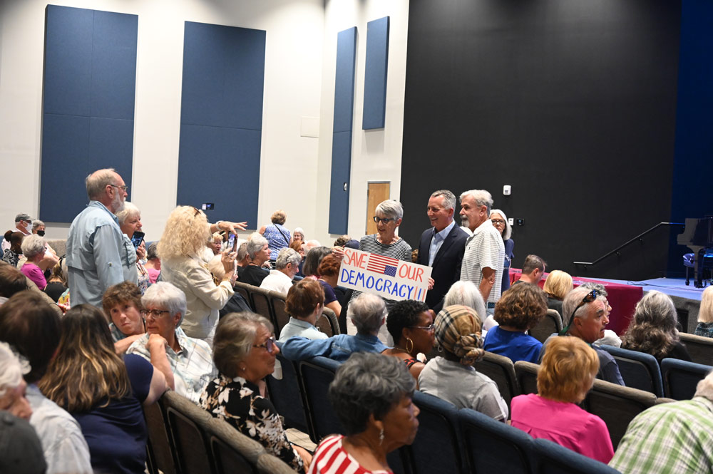 David Jolly, standing in the dark suit, with supporters before his town hall at Palm Coast United Methodist Church on Wednesday. (© FlaglerLive)
