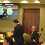 David Snelgrove's brain is at the center of the defense's strategy to ward off a death sentence for him. Snelgrove is to the right. His attorney, Michael Nielsen, is standing. (© FlaglerLive)