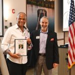 Greg Davis, left, who was honored with the Civility Award, with Tiger Bay President Jay Scherr. (© FlaglerLive)