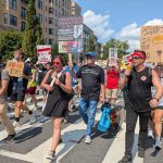 Marchers sang protest songs and led “Trump must go now” chants as they walked down 16th Street NW in Washington, D.C., on Sept. 6, 2025, during the “We Are All DC” demonstration against the deployment of National Guard troops in the nation’s capital. (Photo by Ashley Murray/States Newsroom)