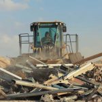 Soldiers from the 206th Engineer Battalion, airmen and civilian contractors remove debris after an Iranian missile attack at Al Asad Air Base, Iraq, Jan. 13, 2020. (Department of Defense)