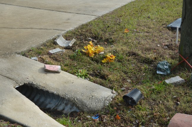 Some of the debris by the culvert investigators believe Barlow struck after the collision with the mailbox. Click on the image for larger view. (© FlaglerLive)