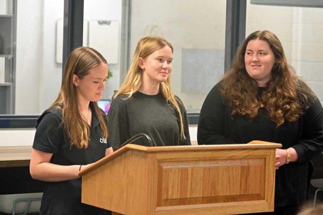 Matanzas High School students and DECA members Lexi Hixon, Natalie Plambeck and Christa Koehler at today's ceremony. (© FlaglerLive)