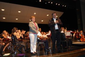 Former superintendent Bill Delbbrugge, who created the Flagler Youth Orchestra in 2005, with former Superintendent Janet Valentine, at an FYO concert in 2010. (© FlaglerLive)