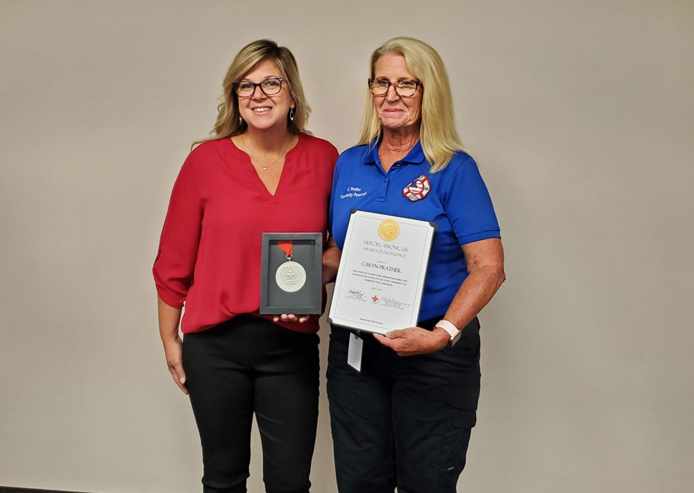 Red Cross Space Coast Chapter Executive Director Rebecca DeLorenzo with Caryn Prather. (Flagler County)