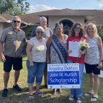 Angelina DeMaio, in the red shirt, is one of the five recipients of the Cultural Council's scholarship. Members of the council delivered the news. Click on the recipients' names below to see their picture.