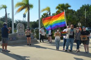 A small demonstration in support of LGBTQ rights preceded Tuesday evening's school board meeting. (© FlaglerLive)