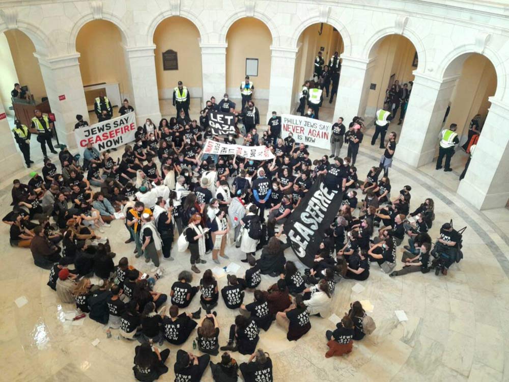 Protesters from the progressive organization Jewish Voice for Peace chant “cease-fire now” and “free Palestine” inside the U.S. House Cannon Office Building rotunda Wednesday, Oct. 18, 2023. U.S. Capitol Police arrested and led protesters away through the New Jersey Avenue exit. The demonstration occurred the same day that President Joe Biden visited Tel Aviv, Israel to announce defense aid as well as humanitarian assistance for Palestinians displaced in the Gaze Strip. (Ashley Murray/States Newsroom)