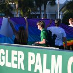 A demonstration outside Flagler Palm Coast High School in March 2022 protesting the suspension of a student who had led a walk-out against what became known as the "don;t say gay" law, seen by its opponents as justifying hate against the LGBTQ community. (© FlaglerLive)