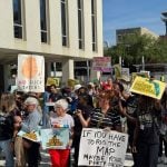 A crowd protesting mid-decade redistricting gathers outside the Florida Capitol while lawmakers convene inside in a special session on the matter on April 28, 2026.