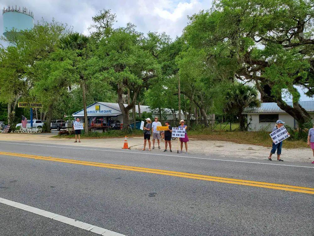 Demonstrators opposng the redevelopment of a former boating manufacturing facility into a boat-storage warehouse have been holding weekly protests in front of the acreage in question on State Road A1A, next to Hammock Hardware. (HCA)