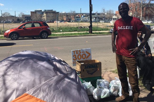 Jerry Burton, 57, stands beside his tent in downtown Denver. A ballot question before Denver voters next week, an initiative called “Right to Survive,” would make sleeping on the streets easier. (Pew Charitable Trust)