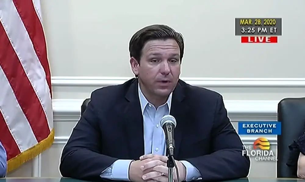 Gov. Ron DeSantis at his afternoon summary briefing on the coronavirus this afternoon. He had refused to impose more stringent lockdown orders across Florida as Covid-19 cases have surged. (© FlaglerLive via Florida Channel)
