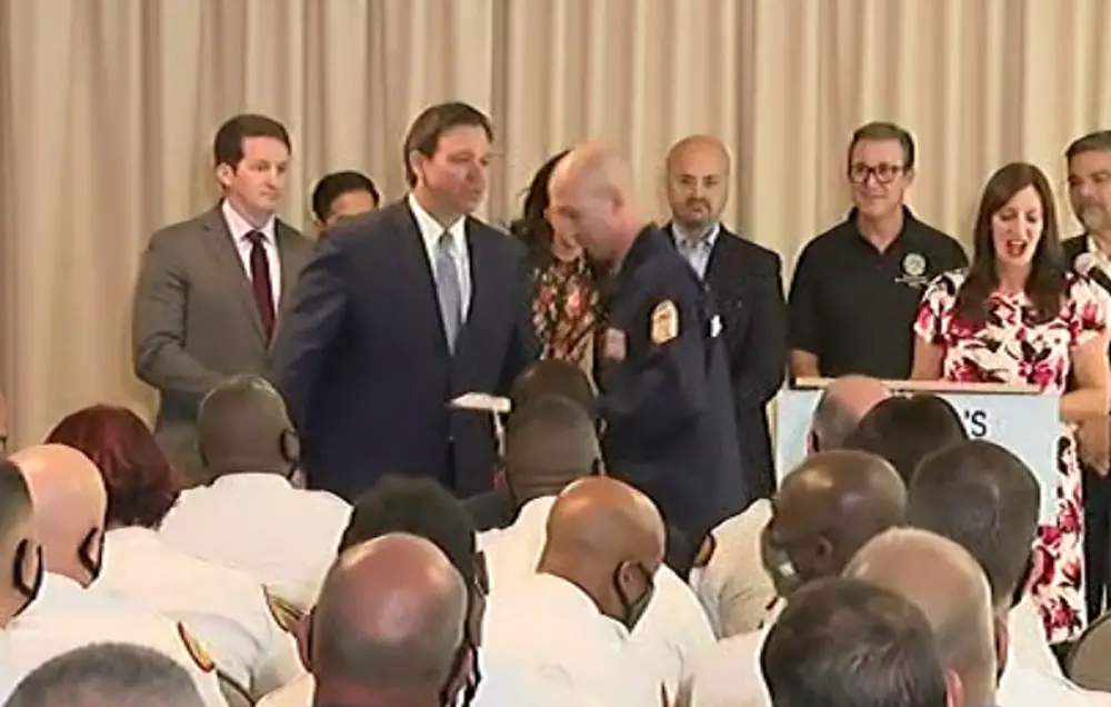 Gov. Ron DeSantis traveled to Surfside, shown here, Jacksonville, and Pensacola to hand out $1,000 bonus checks (paid for with federal COVID aid) to first responders. Source: Screenshot/Florida Channel