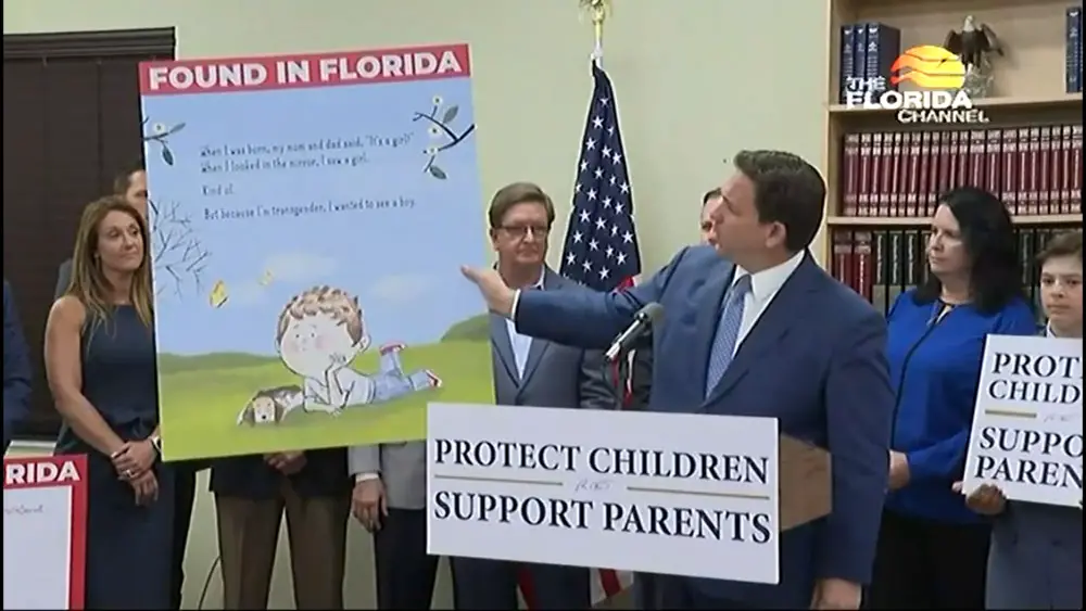 Gov. Ron DeSantis holds a large print of a children’s book about a transgender kid on March 28, 2022 Credit: screenshot/Florida Channel
