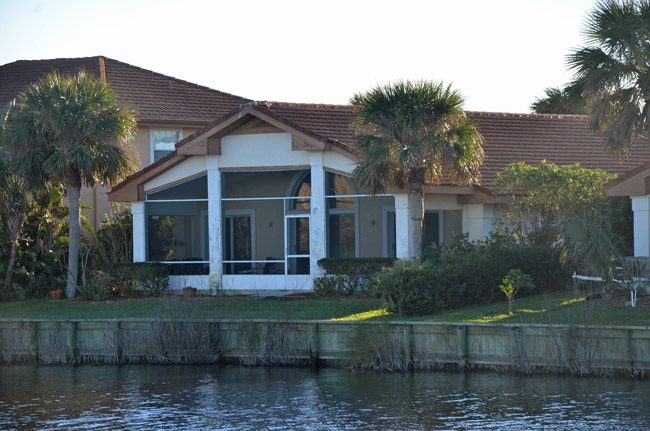 The DeSantis house he's owned at Lakeside b y the Sea since October 2016, from where, a neighbor said, a huge TV would reflect against the lake and stay on all night, though DeSantis appeared not to be in the house. The property went up for sale earlier this week. (© FlaglerLive)