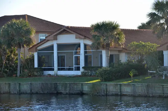 The DeSantis house he's owned at Lakeside b y the Sea since October 2016, from where, a neighbor said, a huge TV would reflect against the lake and stay on all night, though DeSantis appeared not to be in the house. The property went up for sale earlier this week. (© FlaglerLive)