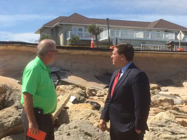 Then-U.S. Rep. DeSantis with Larry newsom, in 2016, surveying Hurricane Matthew damage to State Road A1A in Flagler Beach. (© Rick Belhumeur for FlaglerLive)