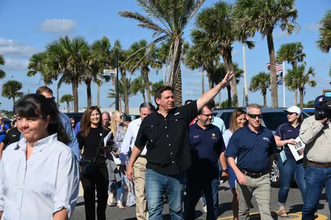 Gov. Ron DeSantis in Flagler Beach today, with, to the right, Rep. Tom Leek, who represents Volusia County, and Rep. paull Renner, who represents Flagler and is the incoming Speaker of the House. (© FlaglerLive)