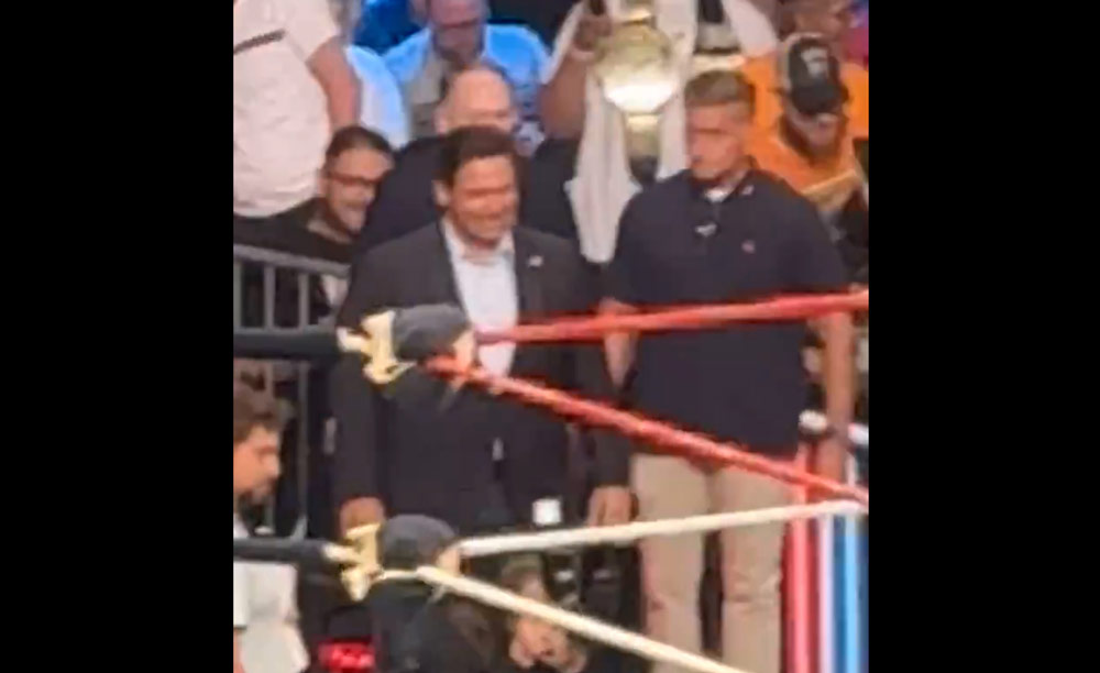 A screen capture from an X video of Gov. Ron DeSantis being jeered at a pro wrestling event.
