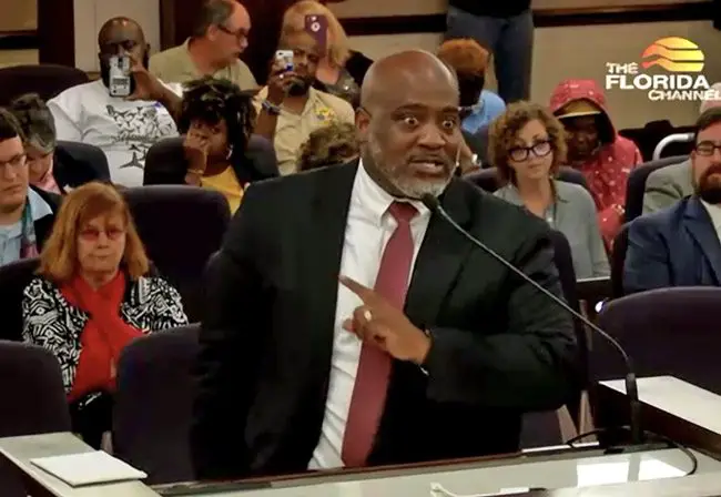Desmond Meade, executive director of the Florida Rights Restoration and chair of the sponsoring committee of Amendment 4 for Floridians for a Fair Democracy, addressing the Senate committee today. (© FlaglerLive cia Florida Channel)