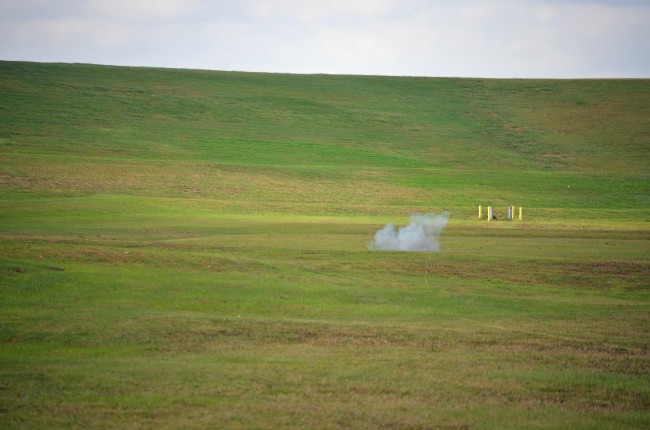 The initial puff from the controlled detonation of the smoke bomb. Images in sequence of the detonation appear below. Click on the image for larger view. (© FlaglerLive)