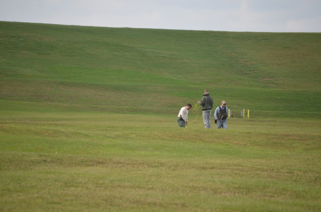 Bomb squad members then went back to the site of the controlled detonation and readied the remains of the bomb to release its smoke safely. Click on the image for larger view. (© FlaglerLive)