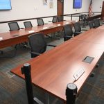 Palm Cast City Hall's directors' seats during Council meetings. The directors and their departments have weathered numerous unsubstantiated accusations about the proper running of the city over the last few years, which today's risk-assessment presentation may help silence. (© FlaglerLive)