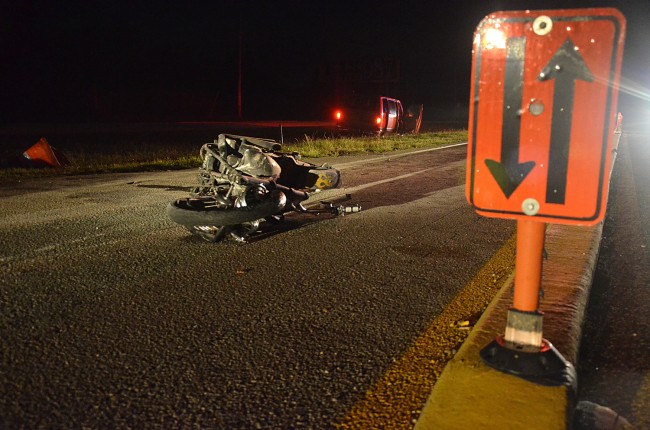 A thin divider splits the temporary northbound and southbound lanes of the narrowed U.S. 1, as construction carries on across the median. The wrecked bike is visible here in relation to where the van ended up, in the median, with its brake lights on. Click on the image for larger view. (© FlaglerLive)