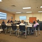 School district Planner Lisa Divina addressing the joint government committee on impact fees and school construction Thursday afternoon at the Government Services Building. (© FlaglerLive)