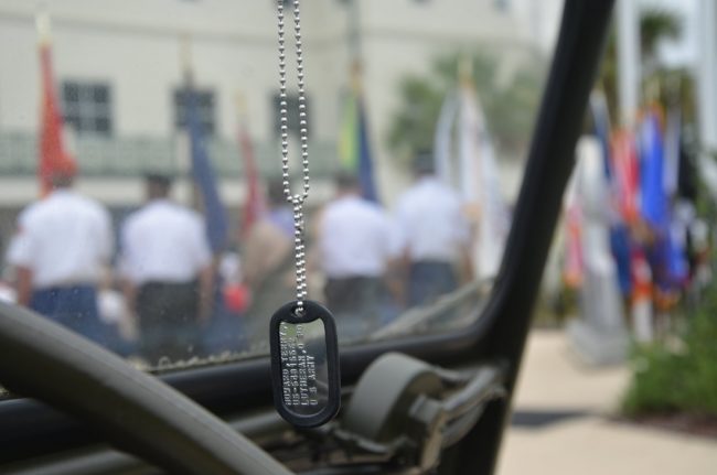A dog tag hanging from an Army Jeep's rearview mirror at today's ceremony in Bunnell. Click on the image for larger view. (© FlaglerLive)