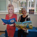 Linda Mahran, founder of the Flagler County Early Literacy Endowment, poses with a cutout of Dolly Parton, whose Imagination Library program the endowment was created to sustain — delivering free books monthly to enrolled Flagler County children from birth to age five. (Community Foundation and United Way of Volusia-Flagler Counties )