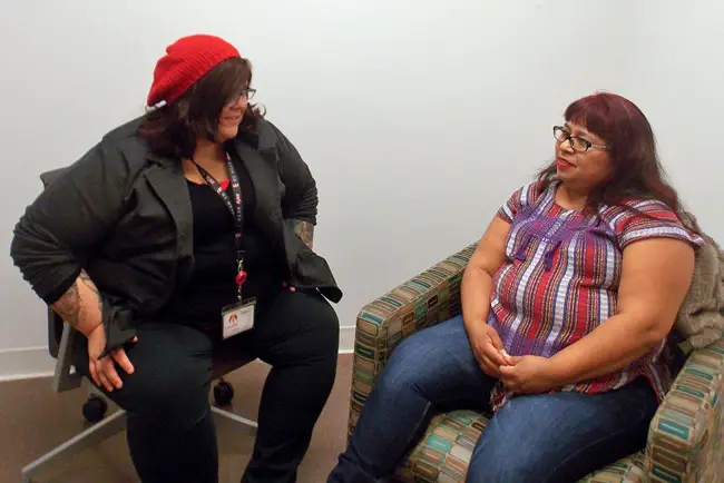 Fanny Ortiz (right), who left an abusive marriage after nearly a decade, meets weekly with therapist Brittany Martinez at the East Los Angeles Women’s Center. The office is located on the campus of the Los Angeles County-USC Medical Center. (Anna Gorman/KHN)
