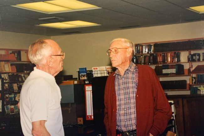 The historian speaking with history: Ghost Town of the Montana Prairie author Don Baker, left, listens to the recollections of Jack Schye, who was born 85 years ago in Ismey ⎯ one of the ghost towns featured in Baker’s book.