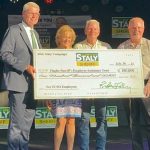 FSEAT check presentation. (L-R) FSEAT Board of Directors Derek Barrs, Sandy Elliot, Mark Strobridge and Sheriff Rick Staly.