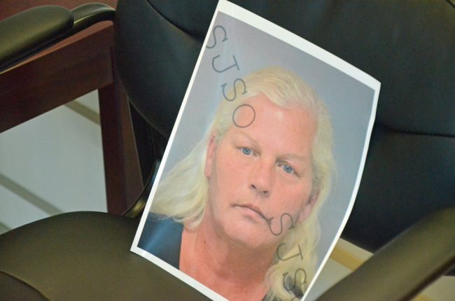 A mugshot of Dorothy Singer the Sheriff's Office printed out from the St. Johns County Sheriff's jail, as it was propped up on a chair during today's news conference. Click on the image for larger view. (© FlaglerLive)