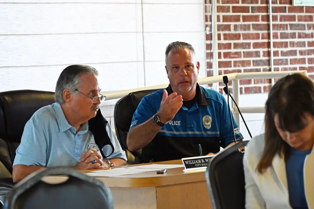 "There’s a reason the NFL doesn’t hold the Super Bowl in a city of 5,000,” says Flagler Beach Police Chief Matt Doughney says. City Manager William Whitson is to the left, Tourism Director Amy Lukasik is to the right. (© FlaglerLive)