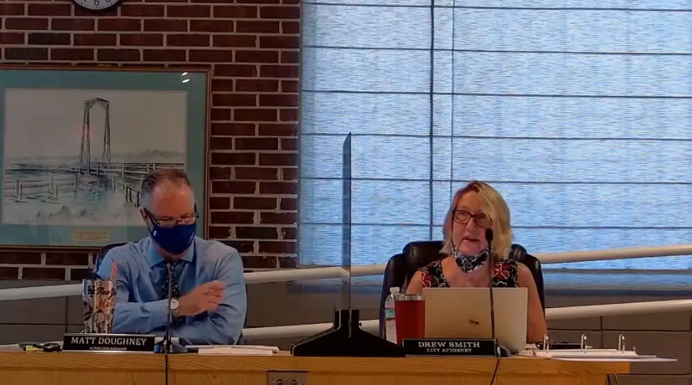 Kathleen Doyle, Flagler Beach's long-time finance director, and Matt Doughney, the police chief sitting in as interim manager during the commission's third day-long budget workshop last week. (© FlaglerLive via YouTube)