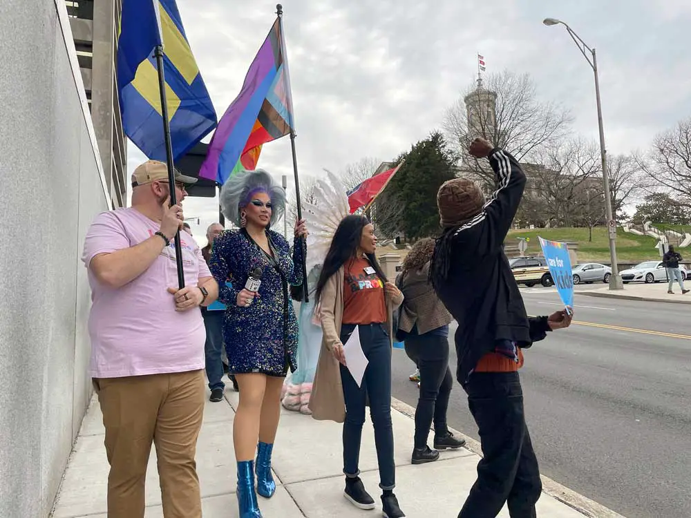 Protesters against a bill restricting drag shows march from a rally outside of the Tennessee Capitol in Nashville on Feb. 14, 2023. 