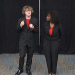 Cameron Driggers and Roymara Louissaint presenting their RedShield company's technology at the MedNexus challenge Wednesday at the Palm Coast Community Center. (© FlaglerLive via YouTube)