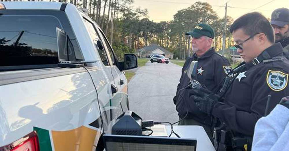 Sheriff Rick Staly, left, and deputy Christopher Nguyen, who was operating the drone that flew over 20 minutes during the standoff on Ricker Place Sunday. (FCSO) 