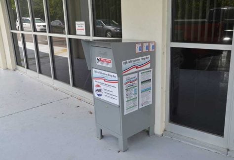 Back in the old days when a drop-box didn;t have to be attended, and could take ballots 24 hours. The Legislature and Gov. Ron DeSantis changed that law, restricting the location and availability of ballot boxes and increasing their costs to supervisors of election. (© FlaglerLive)