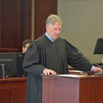Circuit Judge Terence Perkins collecting himself after what had been an emotional segment of a Drug Court graduation ceremony in April 2019 at the Flagler County courthouse. The judge appeared before the County Commission this morning, with many of the personnel who make up the Drug Court administration, to accept a proclamation and introduce the participants. (© FlaglerLive)