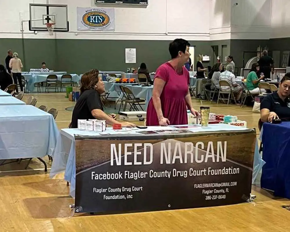 Members of the Flagler County Drug Foundation at a community event at the Carver Center in Bunnell last May, when they talked about the life-saviong capacities of Narcan. Foundation personnel urged the Flagler County School Board last month to make Narcan available in schools. The board today decided to do so. (Facebook)