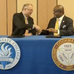Daytona State College President Dr. Tom LoBasso and Bethune-Cookman University Interim President Dr. Lawrence Drake sign an articulation agreement supporting students pursuing careers in criminal justice. (DSC)