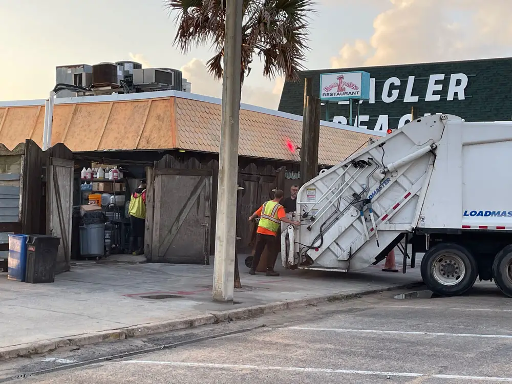 The dumpster pad outside the Funky pelican that's had no dumpster for years, because it would be too heavy for the deteriorated condition. The pad is to be rebuilt and expanded by about 50 percent through a $420,000 contract. (© FlaglerLive)