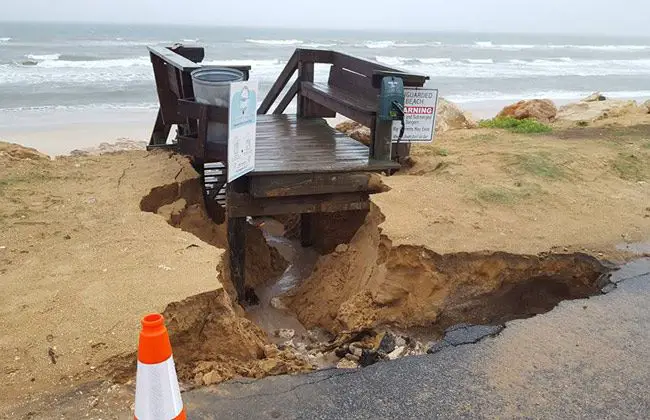 The rainstorm excavated the dune from under the walkover at South 20th Street in Flagler Beach. (© Ed Siarkowicz)