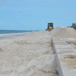 A Flagler Beach commissioner is hoping that sand dredged for the U.S. Army Corps of Engineers project in the city will be used to re-bury the sea wall built a year and a half ago at the north end of town. (© FlaglerLive)